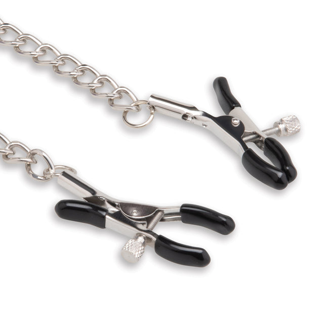 Metal nipple clamps with black handles on a white background