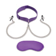 Purple choker with chain and matching satin blindfold on a white background